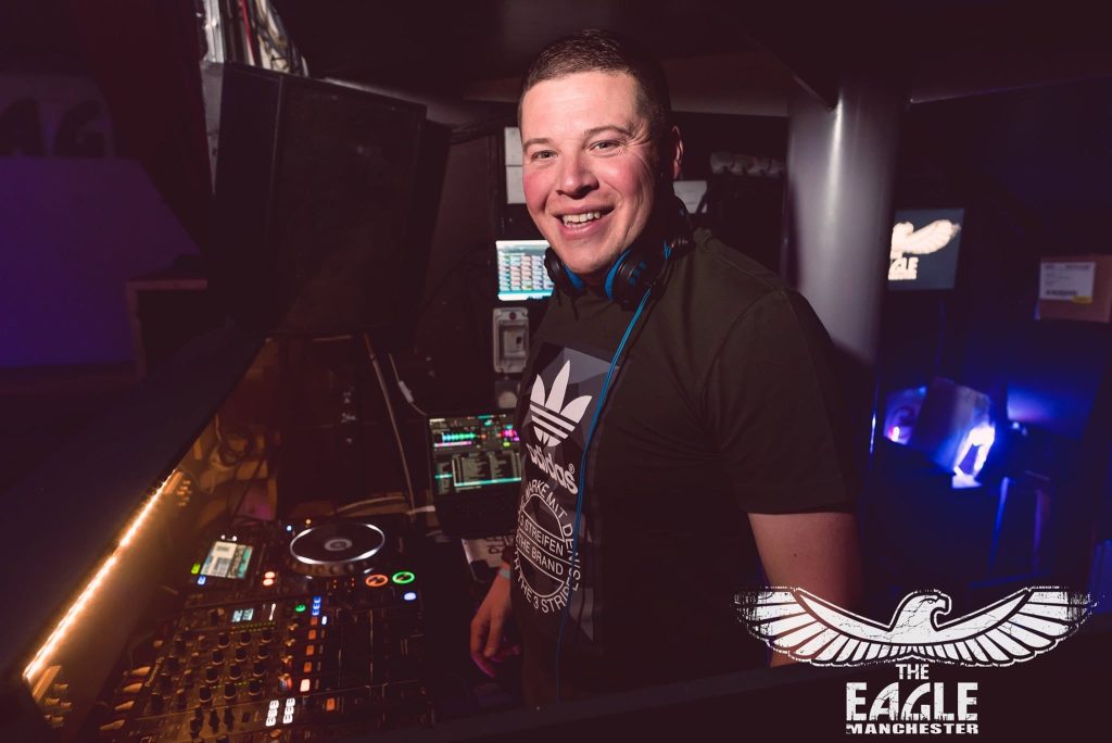 DJ Rick Parker behind the decks during a live house music set at The Eagle Manchester.